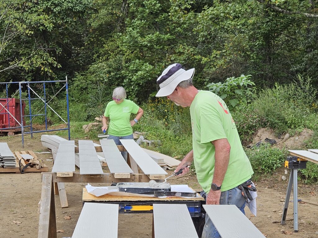 Two men using saw horses